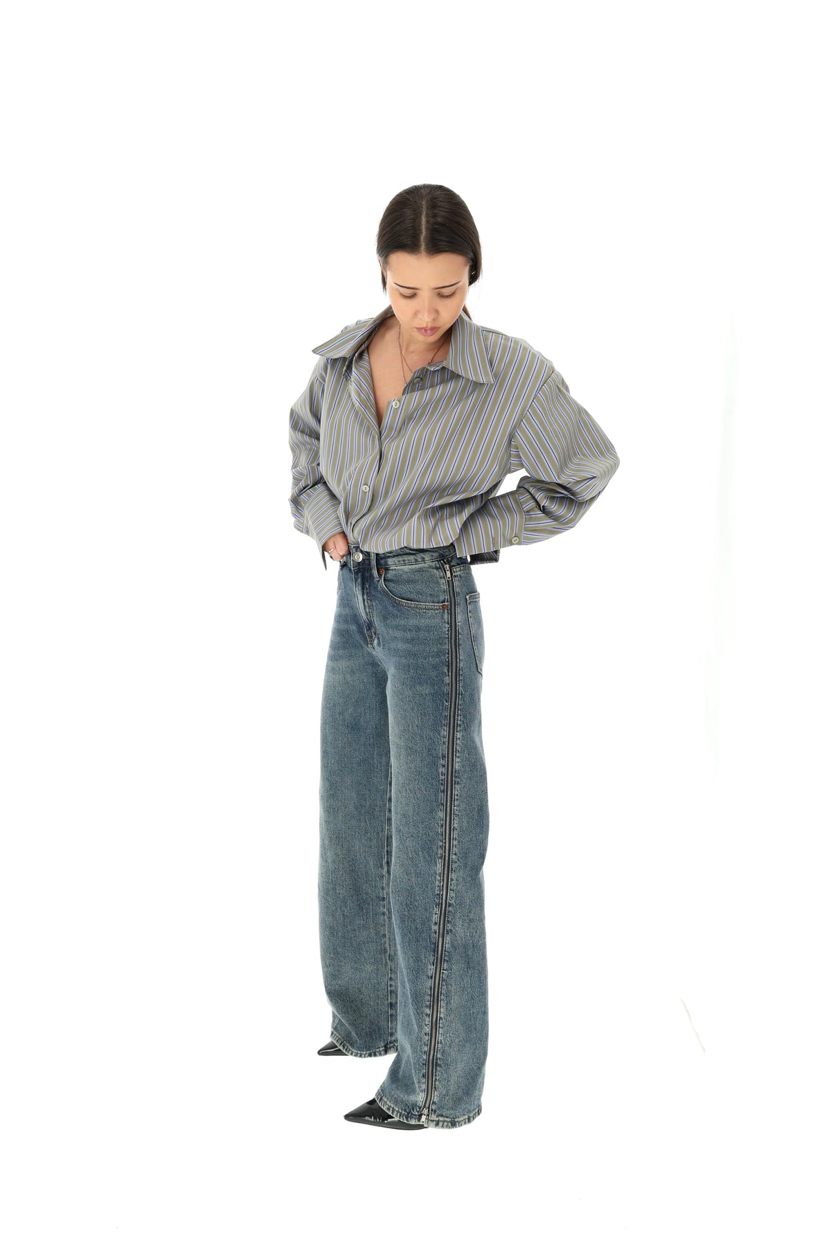 Platėjantys džinsai su užtrauktukais